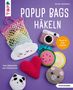 "POPUP BAGS HÄKELN" in großen weißen Buchstaben. Bunte gehäkelte Objekte wie Wolke, Herz und Früchte auf violettem Hintergrund.
