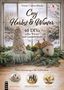 "Vonny Camin-Bösch: Cozy Herbst & Winter. 40 DIYs voller Wärme und Gemütlichkeit. Drei stimmungsvolle Farbwelten." Ein Fensterblick zeigt DIY-Dekorationen aus Naturmaterialien, darunter Zapfen und Filzelemente in Pastell- und Erdtönen., Buch