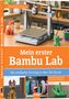 "Stephan Knaus. Mein erster Bambu Lab. Der einfache Einstieg in den 3D-Druck. Besonders geeignet für A1, A1 mini, A2 und P2." 

Ein 3D-Drucker mit gedruckten Objekten auf einem Tisch. Unten links und rechts sind weitere Bilder von 3D-Modellen und Filamenten., Buch