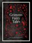 "Grimms' Fairy Tales" in einem dekorativen, roten floralen Rahmen. Eule und Fuchs als Illustrationen., Buch