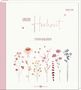 Texte: "UNSERE Hochzeit", "Erinnerungsalbum", "Irmgard Erath". Illustrationen von Blumen und Herzen auf einem hellen Hintergrund., Buch