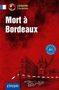 "Mort à Bordeaux" steht groß in weißer Schrift. Eine Zeichnung zeigt eine Stadtszene mit einem Turm und Straßenabsperrung., Buch