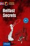 Titel: "Belfast Secrets". Illustration: Person mit Hula-Hoop vor Gebäude. Text: "Lernkrimi", "3 Kurzkrimis", "Niveau B1"., Buch