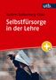 Text: "Selbstfürsorge in der Lehre" von Kathrin Rothenberg-Elder. Unten liest jemand ein Buch vor einer Ziegelwand., Buch