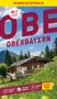 Nr. 1 meistgekaufter Reiseführer. Oberbayern. Berghütte vor Alpenkulisse, Wiesenblumen im Vordergrund., Buch