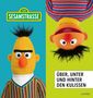 "SESAMSTRASSE", "ÜBER, UNTER UND HINTER DEN KULISSEN". Links: Figur mit senkrechtem Haar. Rechts: Figur kopfüber., Buch
