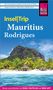 "Insel|Trip Mauritius Rodrigues" steht auf einem Reiseführer mit Strand, Palmen und einem Berg im Hintergrund.