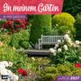 „In meinem Garten“, darunter „In My Garden“. Eine Bank in blühendem Garten mit Rosen und Teich. Enthält Jahresplaner für 2027., Kalender