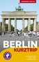 "Trescher Verlag", "Berlin Kurztrip", "Mit herausnehmbarer Faltkarte". Menschen vor dem Brandenburger Tor.