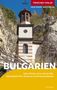 „Trescher Verlag. Mehr wissen, besser reisen. Bulgarien.“ Ein Kloster in den Felsen, blauer Himmel, Natur im Hintergrund., Buch