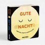„GUTE NACHT“ in Orange auf einem schlafenden gelben Mondgesicht. Autoren: Meritxell Martí & Xavier Salomó., Buch