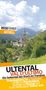 Reiseführer: Ultental, Val d'Ultimo, mit Kirche im Tal vor bewaldeten Bergen unter bewölktem Himmel., Buch