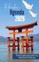 "Haiku Agenda 2026." Zwei Kraniche fliegen über ein rotes Torii im Wasser, Berge im Hintergrund, klarer blauer Himmel., Buch