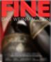 Text: "FINE DAS WEINMAGAZIN". Im Hintergrund verschwommen eine Nahaufnahme einer Weinflasche und Glas., Buch