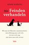 Text: "Adam Kahane - Mit Feinden verhandeln". Silhouetten von einem Hund und einer Katze gegenüber auf rotem Hintergrund., Buch