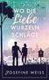 Text: "Wo die Liebe Wurzeln schlägt", "Roman", "Josefine Weiss", "Feuer Werke Verlag". Silhouettenpaar vor Gartenzaun., Buch