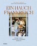 "Ein Hauch Frankreich" - Rezepte und französisches Lebensgefühl. Zwei Personen in einer Küche mit Kupfertöpfen., Buch