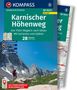 KOMPASS Wanderführer: Karnischer Höhenweg, 28 Touren. Bild zeigt Wanderer vor beeindruckender Berglandschaft., Buch