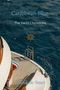 Text: "Caribbean Blue. The Yacht Chronicles. Sea Stories. Anouk de Smet." 
Eine Yacht im Meer von oben, goldenes Steuerrad-Symbol., Buch