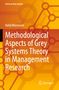 „Methodological Aspects of Grey Systems Theory in Management Research“ von Rafał Mierzwjak. Gelbes geometrisches Muster.