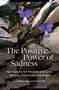 "The Positive Power of Sadness: How Good Grief Prevents and Cures Anxiety, Depression, and Anger" vor Felsen mit Blumen., Buch