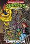 Text: "Teenage Mutant Ninja Turtles Adventures Compendium."  
Comic-Stil, Drachenkopf, Schildkröten und Menschen auf einem Feuerleitertreppenhaus.