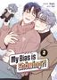 "My Bias is Showing?! Vol. 3" Text. Zwei lächelnde Personen, eine hält eine Plüschfigur. Es gibt Blumen im Hintergrund., Buch