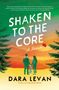 "SHAKEN TO THE CORE" in großer Schrift, darunter "DARA LEVAN". Zwei Personen und ein Hund vor Sonnenuntergang und Bäumen., Buch