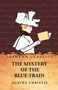"Lushena Classics - The Mystery of the Blue Train - Agatha Christie" 

Illustration einer Frau mit Hut, die ein Buch liest. Hintergrund ist dunkelrot., Buch
