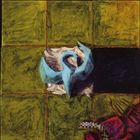 Auf einer grünlichen, karierten Fläche liegt zentral eine blaue, skulpturähnliche Form. Unten rechts ist eine rote Struktur.