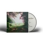 CD-Hülle mit Landschaftsfoto: Zwei Stühle auf einer Lichtung, umgeben von Bäumen, daneben eine CD.