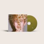 Text: "blondshell", "violins". Eine Nahaufnahme einer Person mit lockigem Haar, teils verdecktem Gesicht und einer CD.