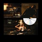 "David Kushner — Devotion". CD-Cover: Person im Lampenschein spielt Gitarre. Enthält Notizen, sanfte Beleuchtung.