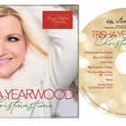 "Trisha Yearwood Christmas Time" Album-Cover. Blonde Frau lächelt in weißem Pelz-Umhang. Liste der Songs auf der CD.
