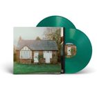 Grünes Vinyl mit Hülle eines Hauses in ländlicher Umgebung.