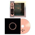 Text: "M83 I WROTE YOU A LETTER". Eine CD mit rosa Kreisdesign, ein Cover mit Küstenlandschaft.
