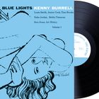 "Blue Lights Kenny Burrell" mit Musikernamen. Illustration einer liegenden Frau. Schwarze Vinylplatte daneben.