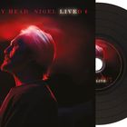 Text: "MURRAY HEAD NIGEL LIVED +". 
Ein Mann im roten Licht von der Seite, daneben eine Schallplatte.