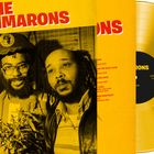 „THE CIMARONS“, „Classic Reggae“, „12 INCH LP“. Zwei Personen, Reggae-Stil, gelbe Schallplatte im Vordergrund.