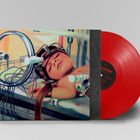 Ein rotes Vinyl mit einem Cover, das ein Kind mit Kabeln und Apparaten zeigt. Der Titel lautet "HELDON".