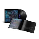 Text: "FRISSON NOIR". Schwarze Vinyl-Schallplatte, Album-Cover mit Porträt und ein Magazin mit einem Kunstbild eines Wolfes.