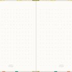 Ein Notizbuch mit gepunkteten Seiten, verziert mit einem Blumenmuster am Rand.
