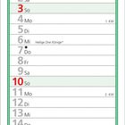 Ein Kalender mit Januar-Daten. Oben zwei schneebedeckte Metallstühle unter einem schneebedeckten Baum.