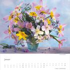 "Januar" steht oben. Darunter ein Kalender und ein Blumenstrauß in lebhaften Pink-, Gelb- und Violetttönen.