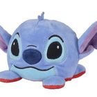 Ein Plüschfigur mit großen, ovalen Augen, blauer Haut, großen Ohren und roten Akzenten an den Pfoten.