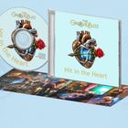CD mit der Aufschrift "Hit in the Heart" und "The Groove Buzz", zeigt ein mechanisches Herz mit einer Rose.
