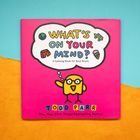 Cover des Buches "What's on Your Mind?" im Comic-Stil, mit gelber Figur und Sprechblase.