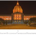Text: „Capitol Building“, darunter ein Kalender mit Zahlen von 1 bis 31. Das beleuchtete Gebäude im Hintergrund ist majestätisch.