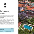 HOTELS, DIE WIR WIRKLICH EMPFEHLEN. Ansicht von oben auf ein Hotel mit rotem Dach, Garten, Pool und blühendem Baum.