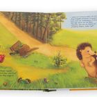 "Verflixtes Hasenpech", murmelt Muckel. ... Illustration mit Hase, Igel, Karren, Waldweg, bunte Eier, grüne Wiese.